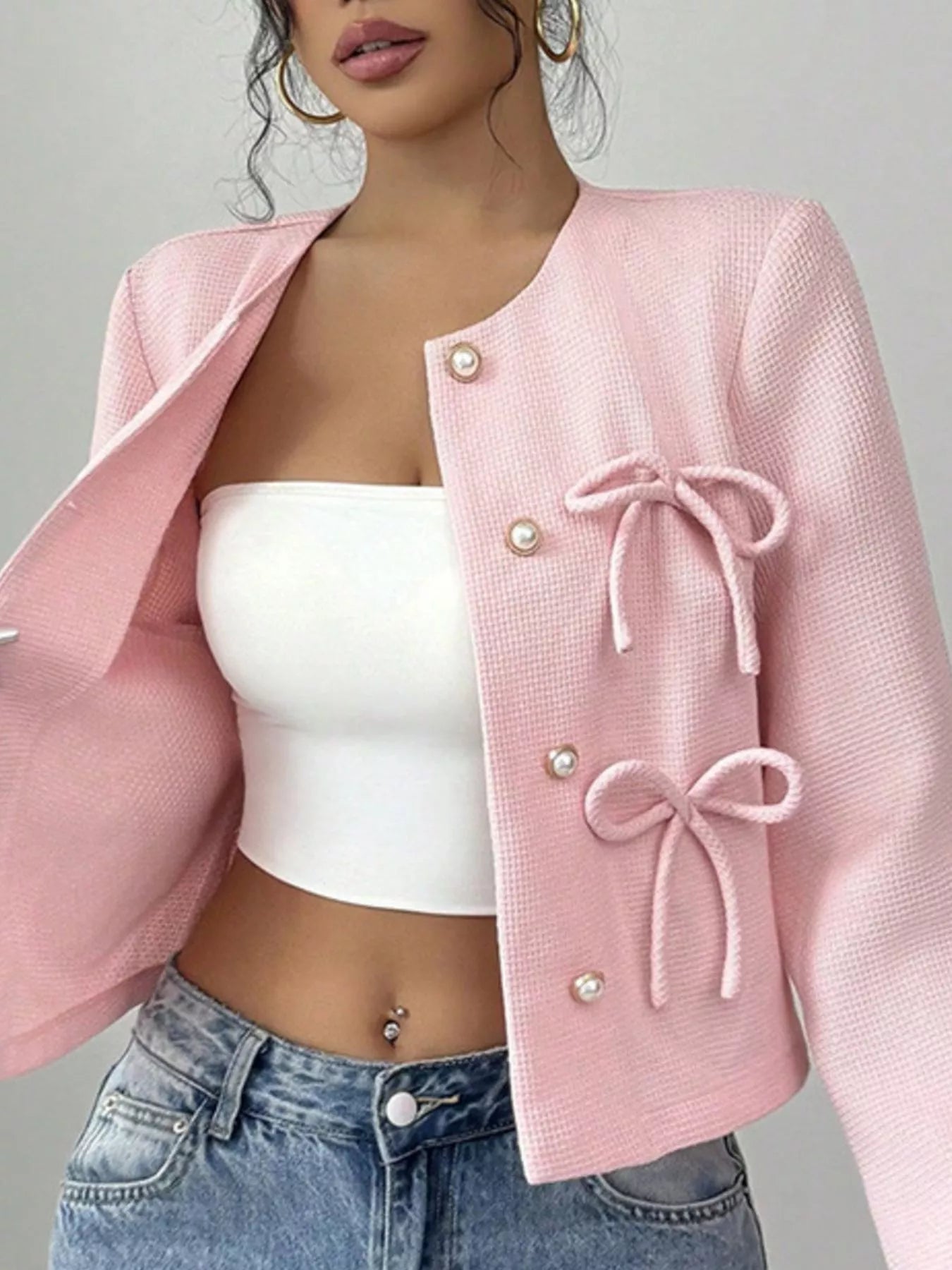 Apricot bow detail cropped outerwear by Trendsi, featuring a stylish front bow and lightweight design for casual wear.