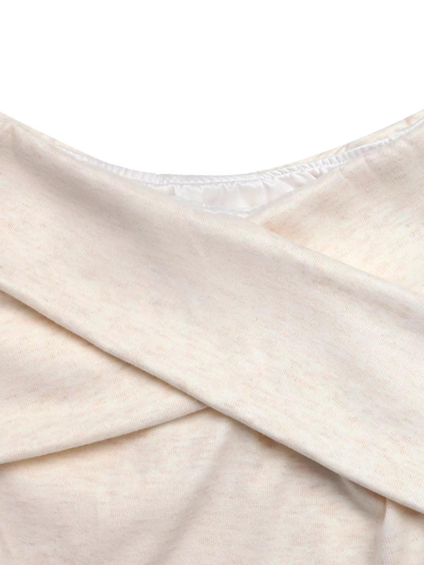 Apricot crisscross off-shoulder long sleeve top by Trendsi, showcasing the stylish neckline and fitted sleeves.