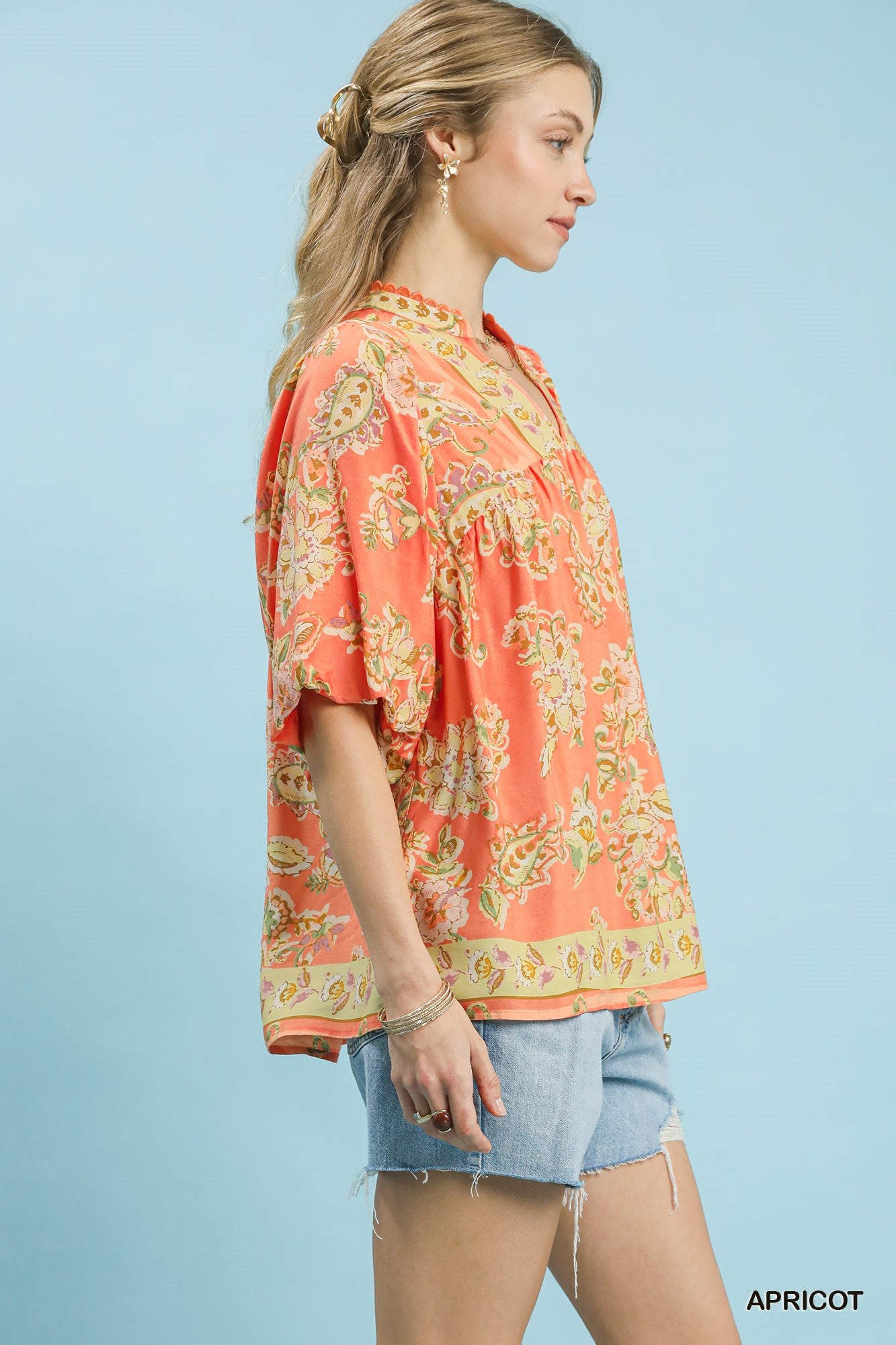 Umgee apricot floral boho blouse with long sleeves and a relaxed fit, featuring a delicate floral pattern and lightweight fabric.