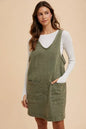 Army green Annie Wear V-neck adjustable strap denim overall dress with front pockets, featuring a casual, stylish design.