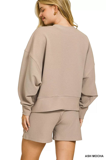Ash Mocha Zenana ribbed round neck pullover and shorts set by Trendsi, featuring a cozy knit fabric and casual loungewear style.