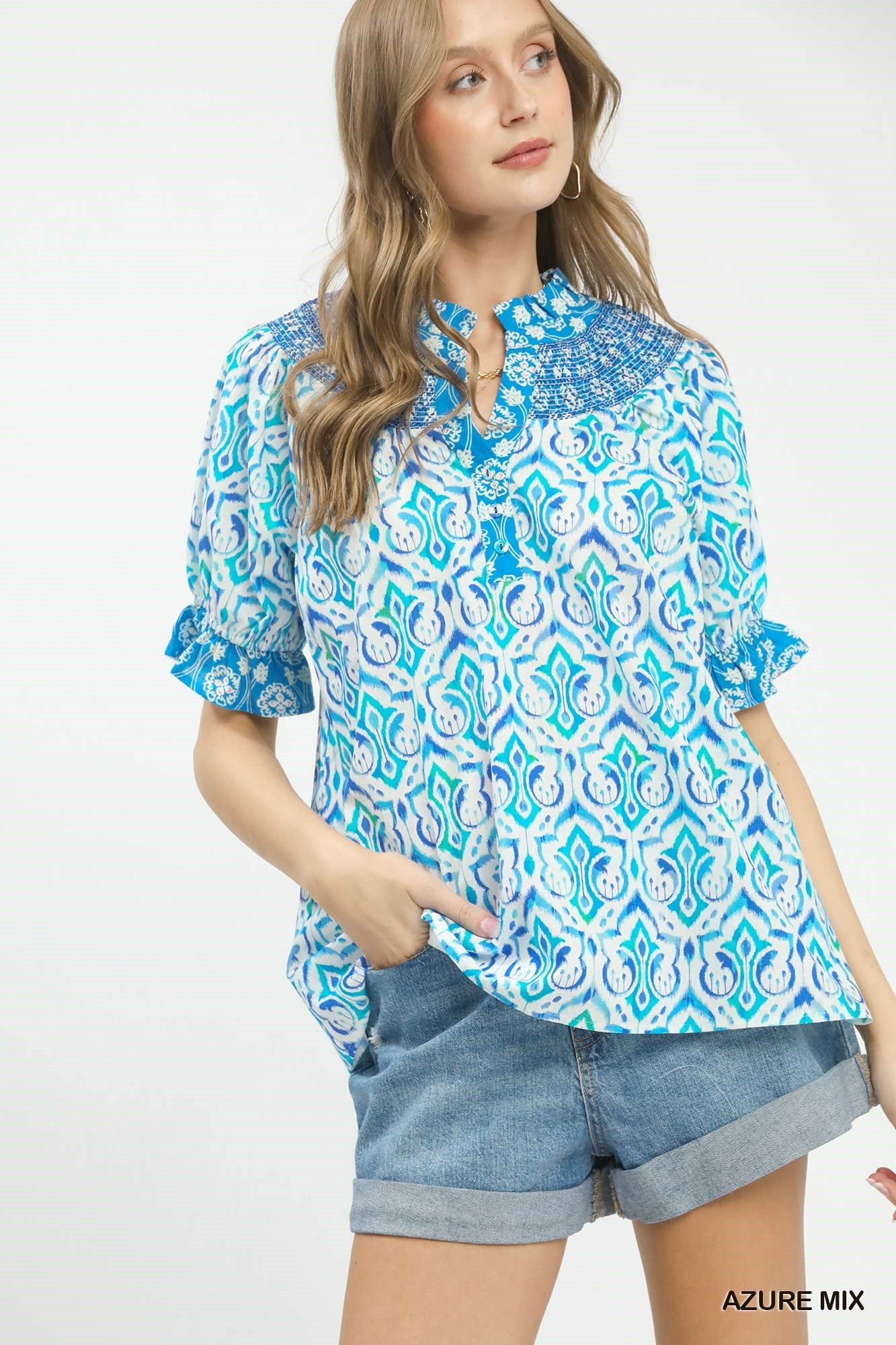 Azure blue Umgee Mix Boho puff sleeve smocked top with relaxed fit and ruffled details, perfect for casual, bohemian style.