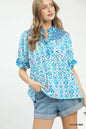 Azure blue Umgee Mix Boho puff sleeve smocked top with relaxed fit and ruffled details, perfect for casual, bohemian style.