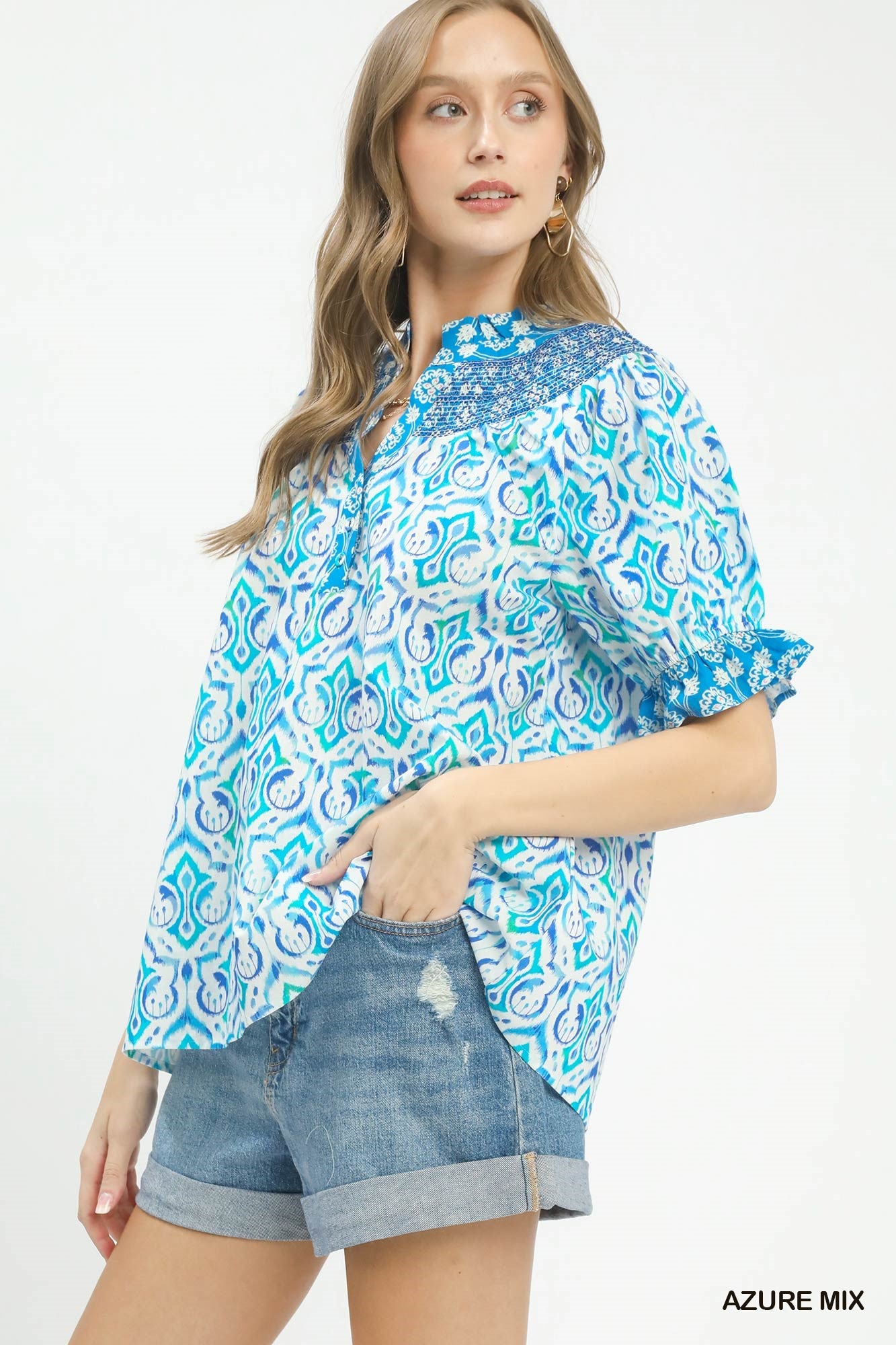 Azure blue boho puff sleeve smocked top by Umgee with a relaxed fit and trendy style, perfect for casual or bohemian outfits.
