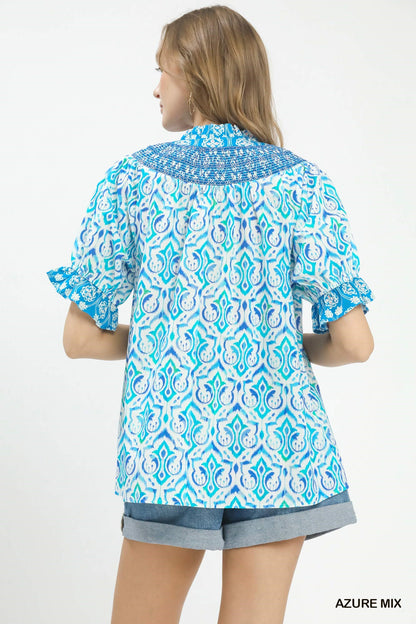 Azure blue Umgee Mix Boho puff sleeve smocked top with ruffled details and relaxed fit, perfect for casual and bohemian styles.