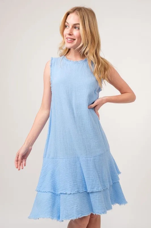 Baby blue washed fringe detail tiered dress by Trendsi, showing flowing fabric with fringe accents and tiered design on a dress.