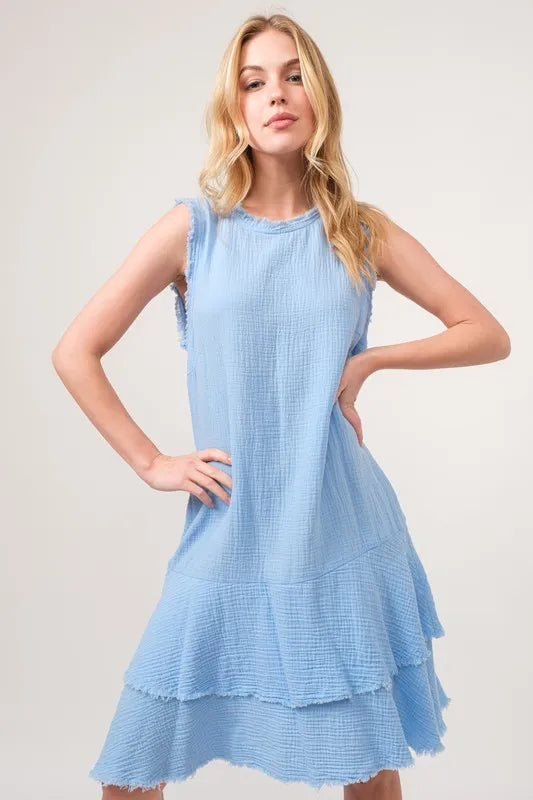 Baby blue tiered dress with washed fringe detail from And The Why by Trendsi, featuring a flowing, bohemian style.