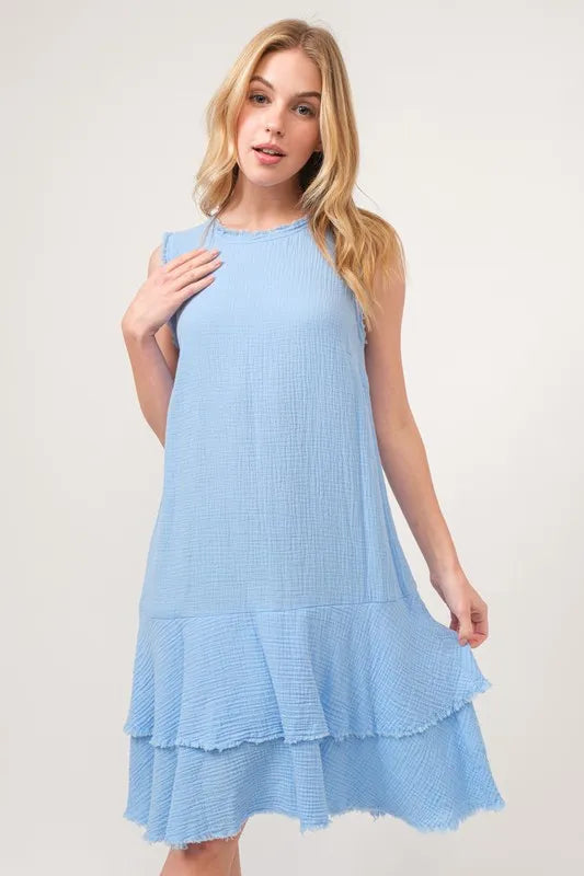 Baby blue tiered dress with washed fringe detail by Trendsi, showcasing the flowing fabric and layered design.