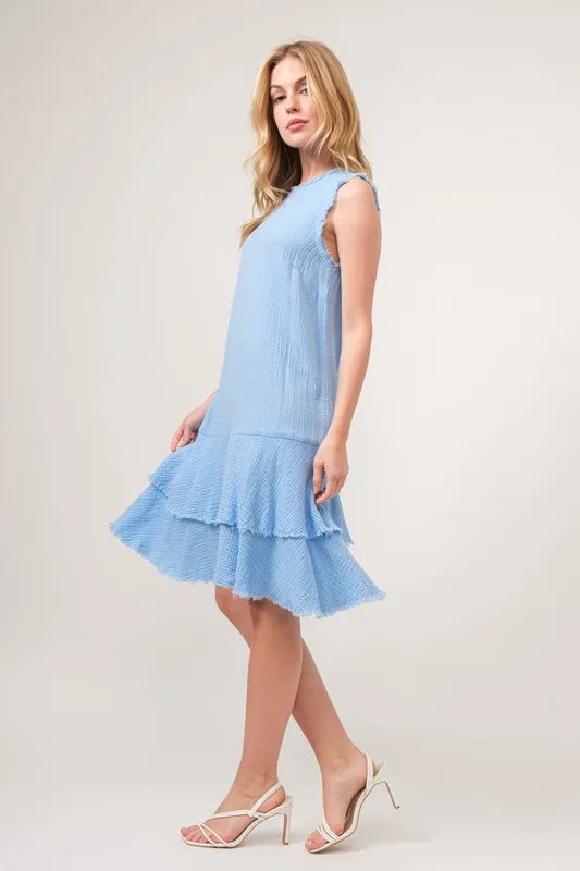 Baby blue tiered dress with washed fringe detail from Trendsi's And The Why collection, featuring a relaxed, boho style.