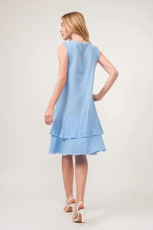 Baby blue tiered dress with washed fringe details from And The Why by Trendsi, featuring a flowing, layered design.