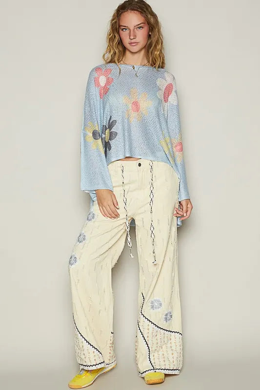 Baby blue POL flower dropped shoulder long sleeve knit top from Trendsi, featuring a relaxed fit and floral design.