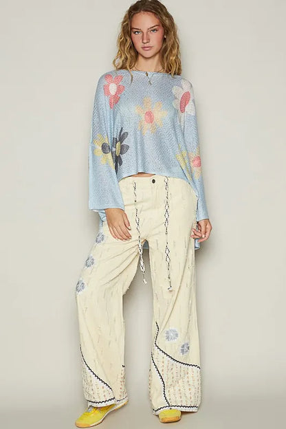 Baby blue POL flower dropped shoulder long sleeve knit top from Trendsi, featuring a relaxed fit and floral design.