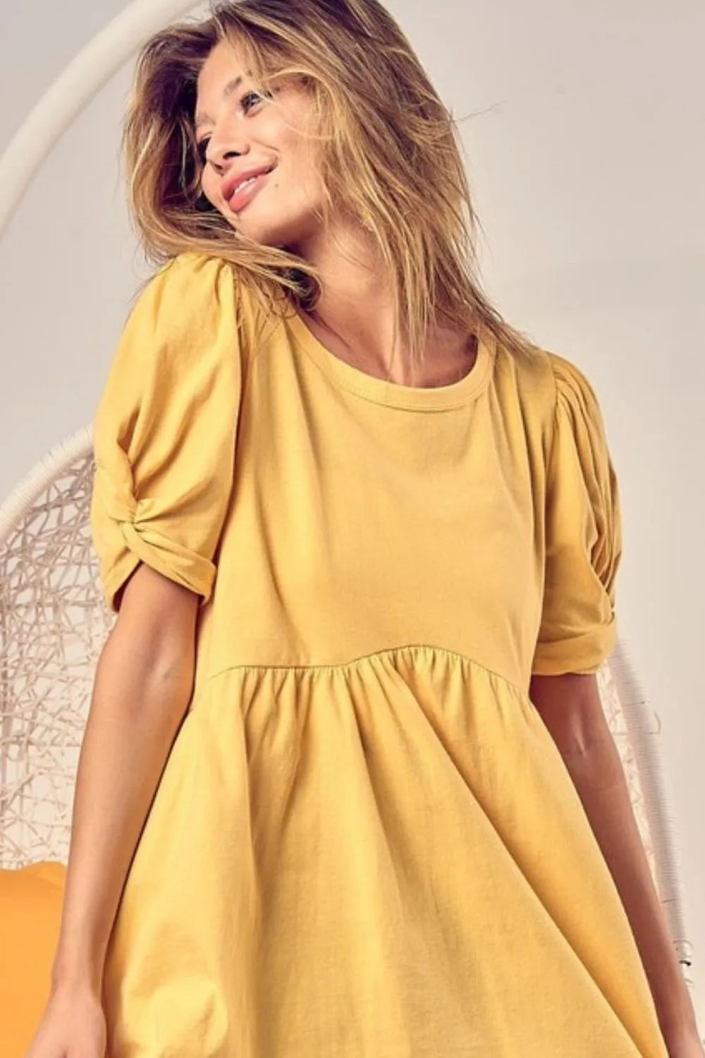 Trendsi BiBi cotton span knit baby doll top with puff sleeves, featuring a stylish, comfortable design in soft fabric.