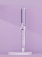 Beige 2-in-1 rotating hair curling iron with European plug from Trendsi, showing the curling barrel and handle design.