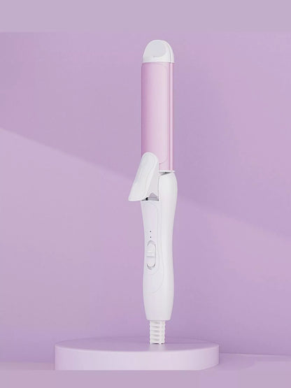 Beige 2-in-1 rotating hair curling iron with European plug by Trendsi, showing the curling barrel and ergonomic handle.