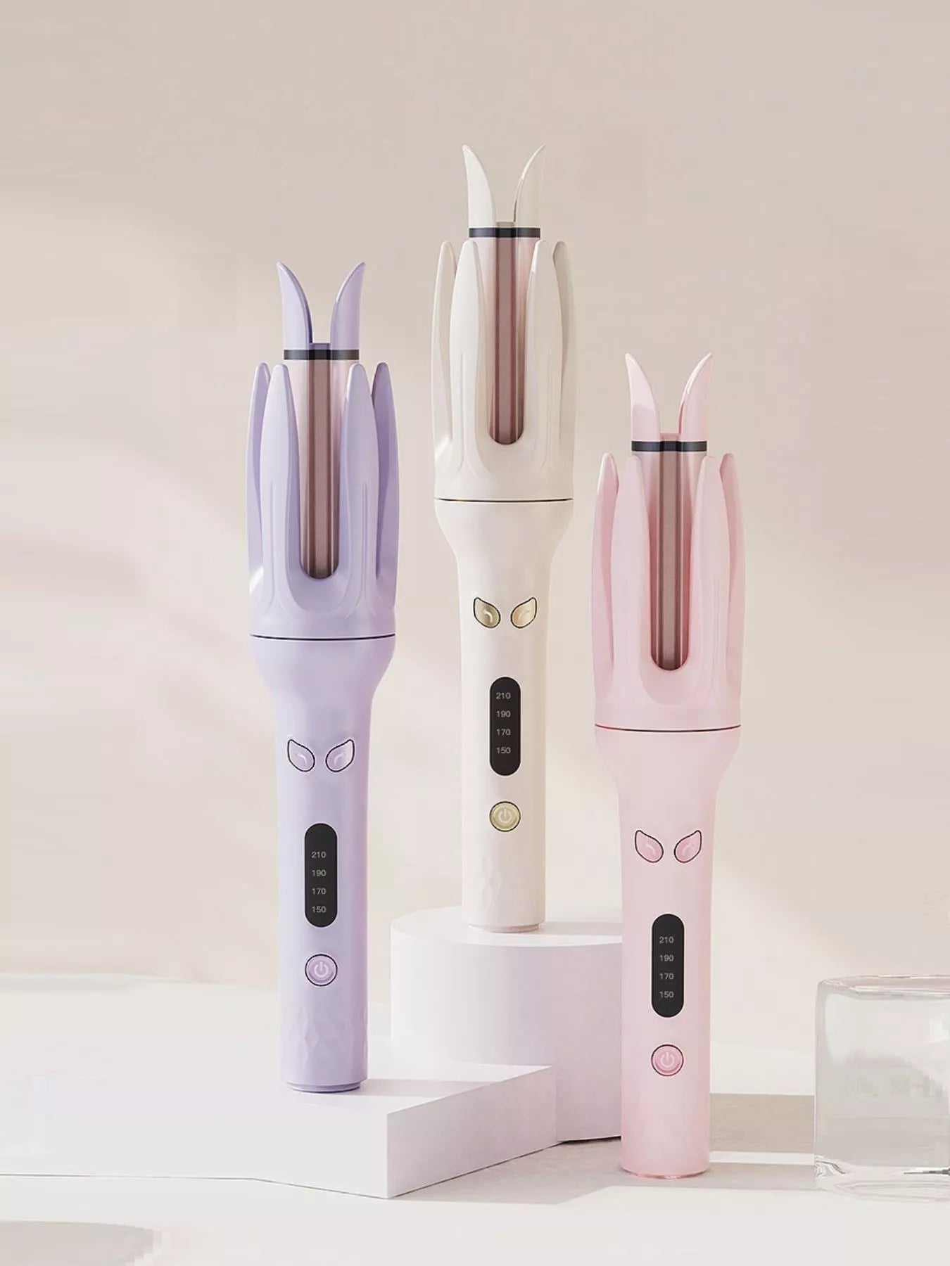 Beige automatic rotating hair curling iron with European plug by Trendsi, showcasing its sleek design and rotating barrel.