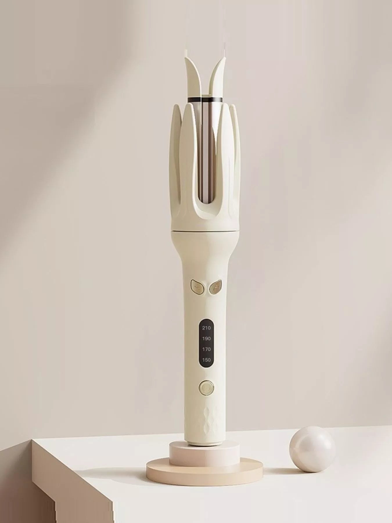 Beige automatic rotating hair curling iron from Trendsi with European plug, showcasing its ergonomic design and rotating barrel.