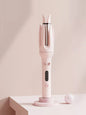 Beige automatic rotating hair curling iron by Trendsi with European plug, showcasing its sleek design and rotating barrel.