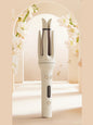 Beige automatic hair curling iron with North American plug by Trendsi, showing the curling barrel and handle.