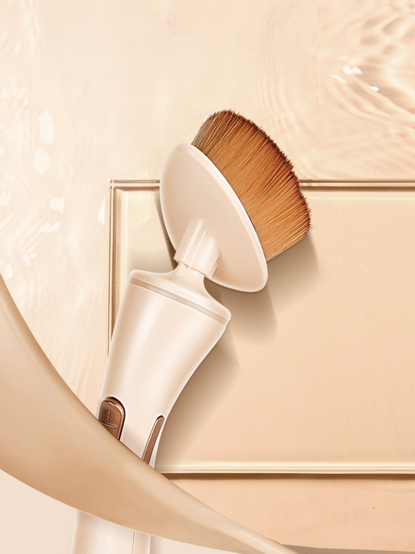 Beige electric makeup brush by Trendsi with a sleek design, suitable for applying foundation and blending makeup seamlessly.
