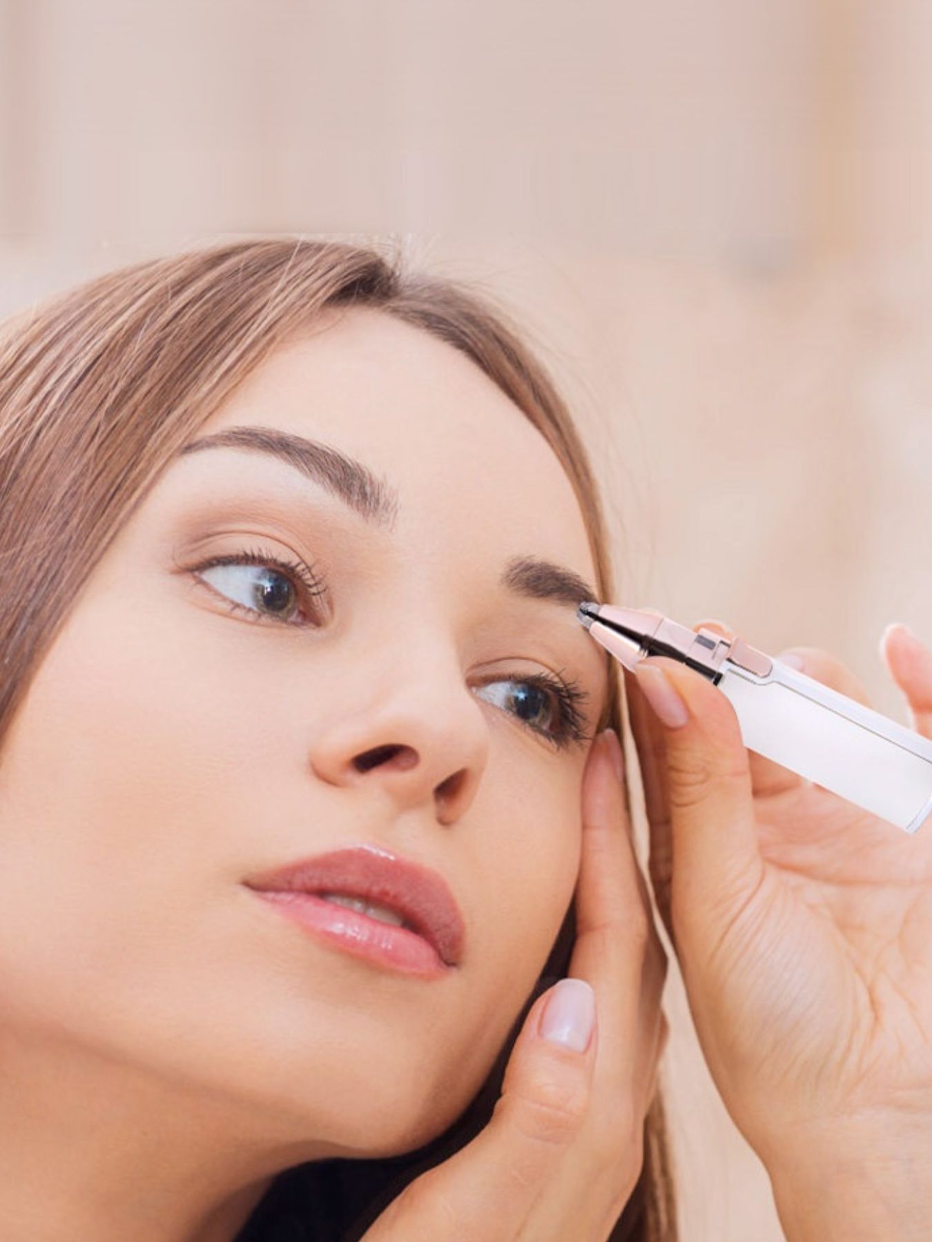Beige portable eyebrow trimmer by Trendsi with compact design for precise grooming and easy handling.