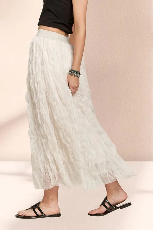 Beige ADORA elastic waist cloud fluffy maxi skirt by Trendsi, featuring a soft, flowy fabric and comfortable elastic waistband.