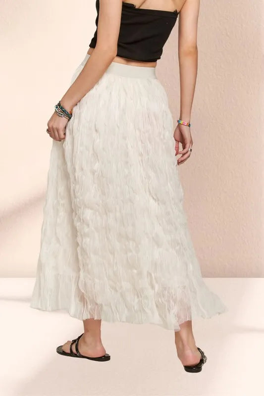 Beige ADORA elastic waist cloud fluffy maxi skirt from Trendsi, featuring a soft, flowing fabric and comfortable fit.