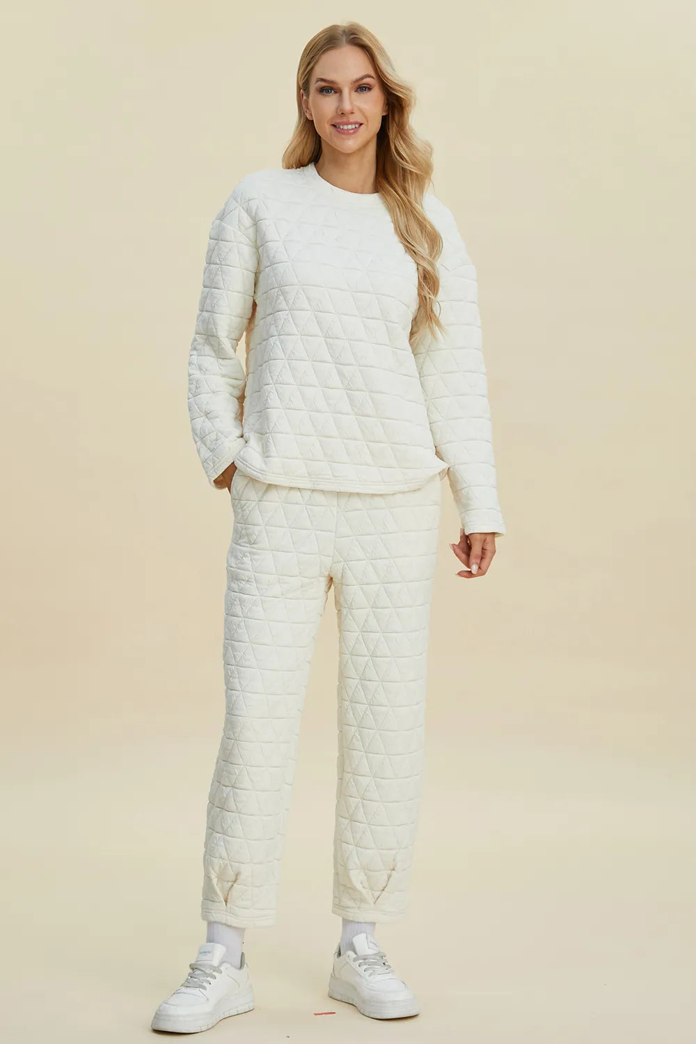 Beige double take full-size textured long sleeve round neck top and matching pants set by Trendsi, stylish and comfortable casual wear.
