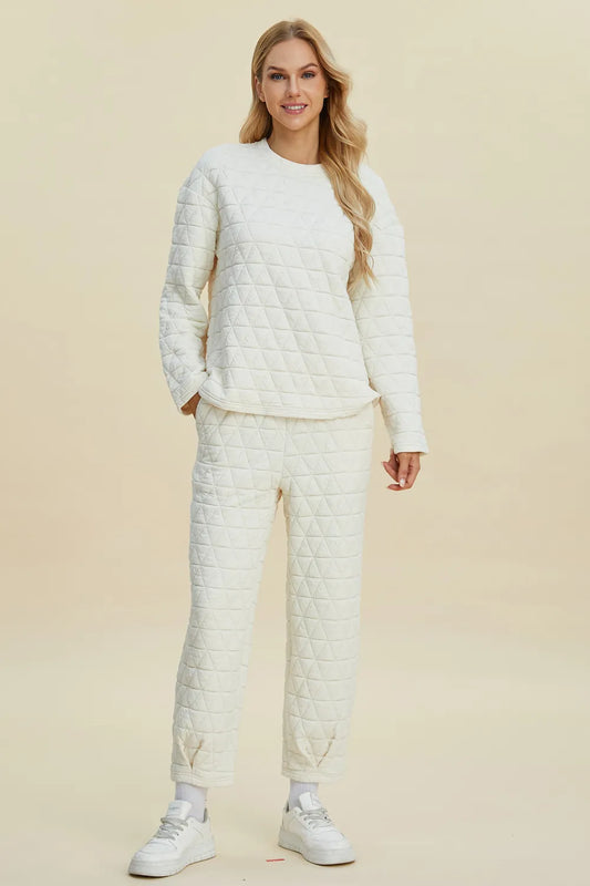 Beige double take full-size textured long sleeve round neck top and matching pants set by Trendsi, stylish and comfortable casual wear.
