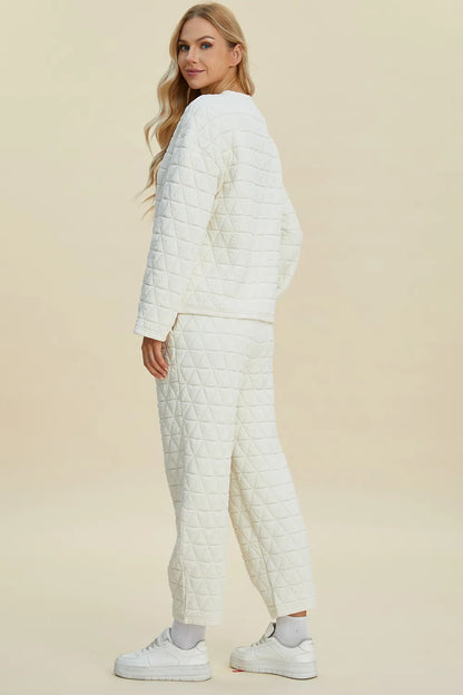 Beige double take full-size texture round neck long sleeve top and matching pants set by Trendsi, casual loungewear ensemble.