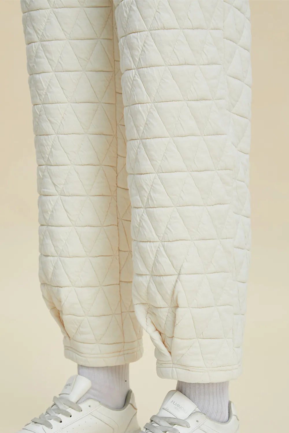 Beige double take full size texture long sleeve round neck top and matching pants set by Trendsi, casual and comfortable outfit.