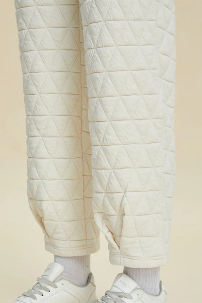 Beige double take full size texture long sleeve round neck top and matching pants set by Trendsi, casual and comfortable outfit.