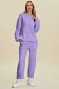 Beige double take texture round neck long sleeve top and pants set by Trendsi, stylish and comfortable full-size outfit.