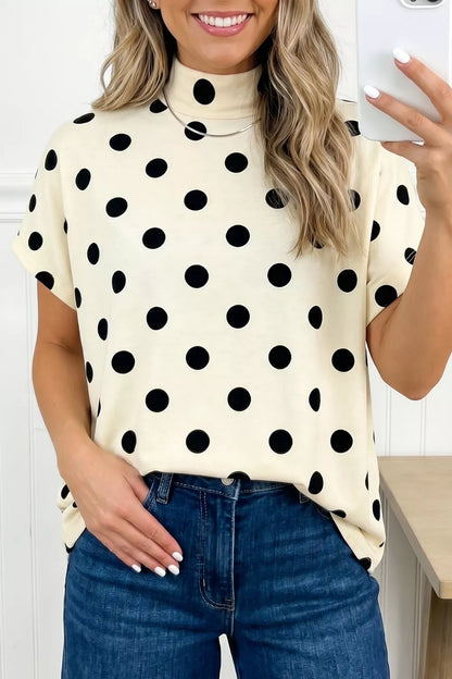 Beige polka dot mock neck short sleeve blouse by Trendsi, featuring a stylish mock neck and classic polka dot pattern.