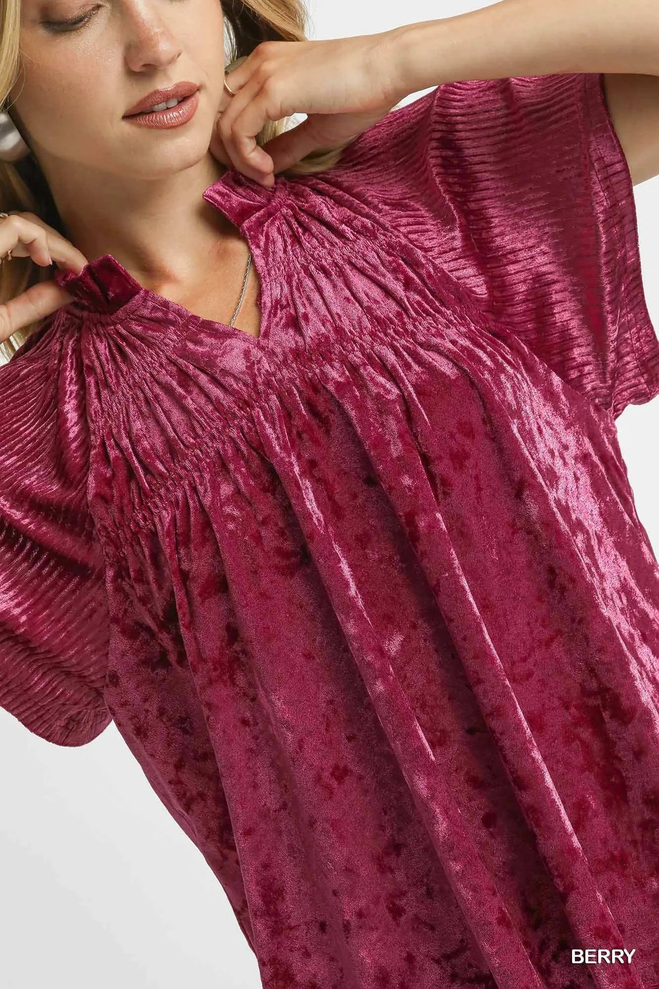 Crushed velvet pleated blouse in berry color from Umgee, styled with long sleeves and a relaxed fit.