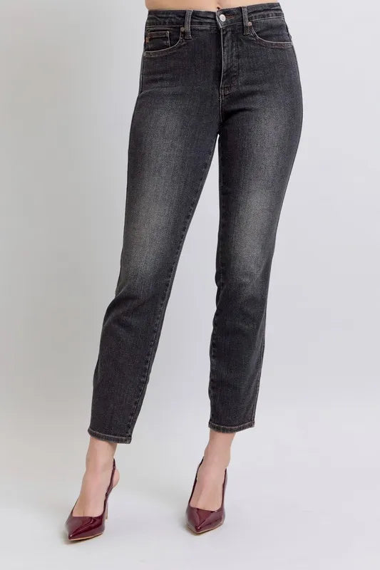 Plus size Judy Blue slim jeans with mid-rise waist and tummy control, featuring classic denim look and slim fit.