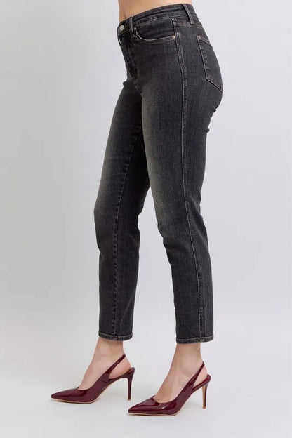 Full size Judy Blue mid-rise slim jeans with tummy control, plus size, featuring classic denim look and front pockets.