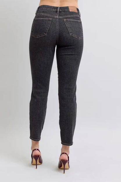 Full view of Judy Blue plus size mid-rise tummy control slim jeans, showing the dark wash, fitted style, and classic jean details.