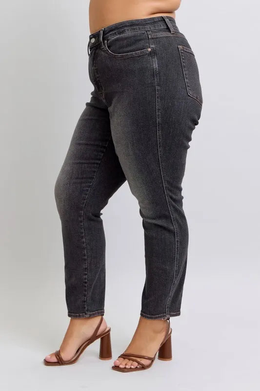 Full view of Judy Blue plus size mid-rise slim jeans with tummy control, showcasing the dark wash and classic five-pocket design.