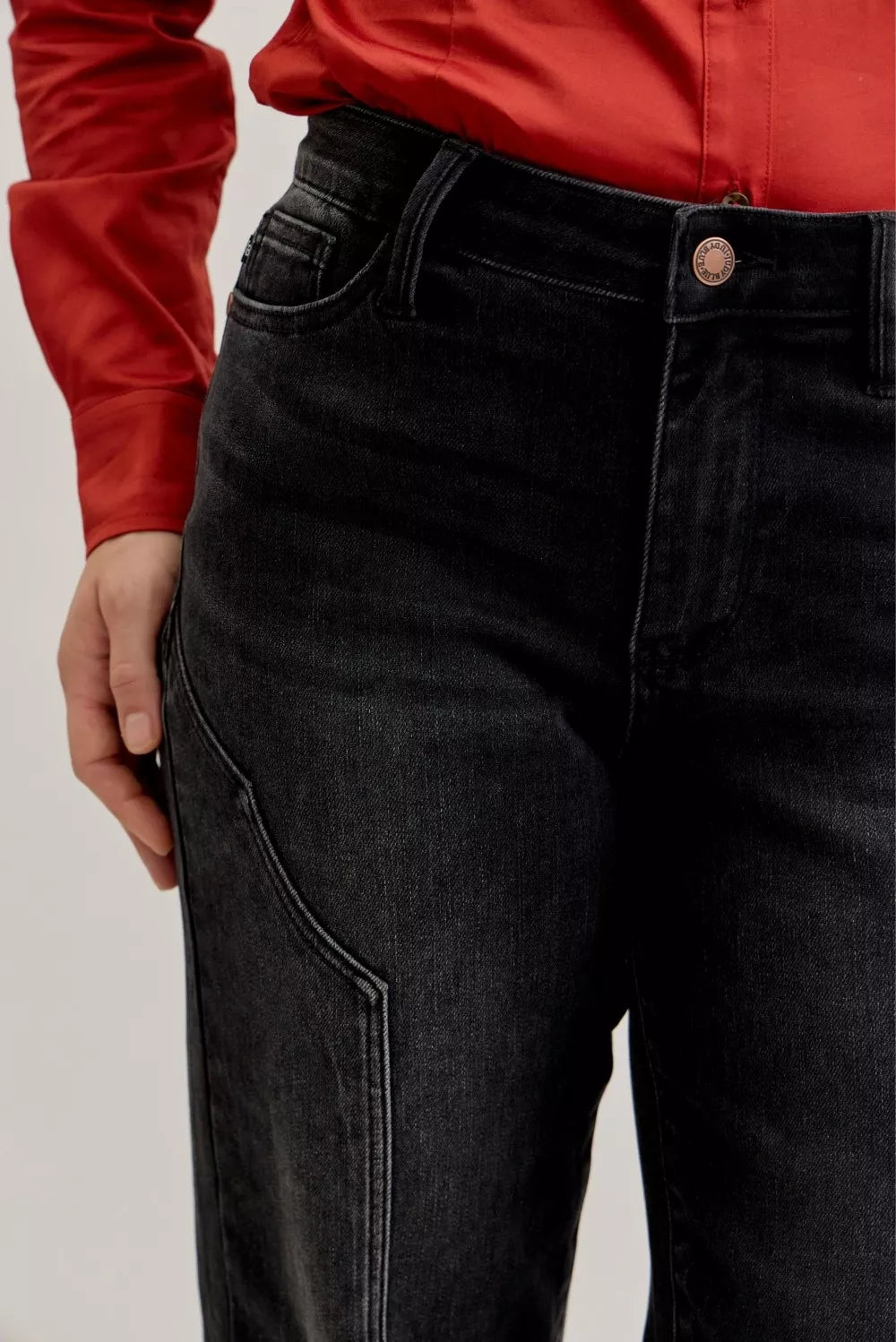 Judy Blue mid-rise straight jeans with western seam details, denim fabric, and classic fit, shown on a model.