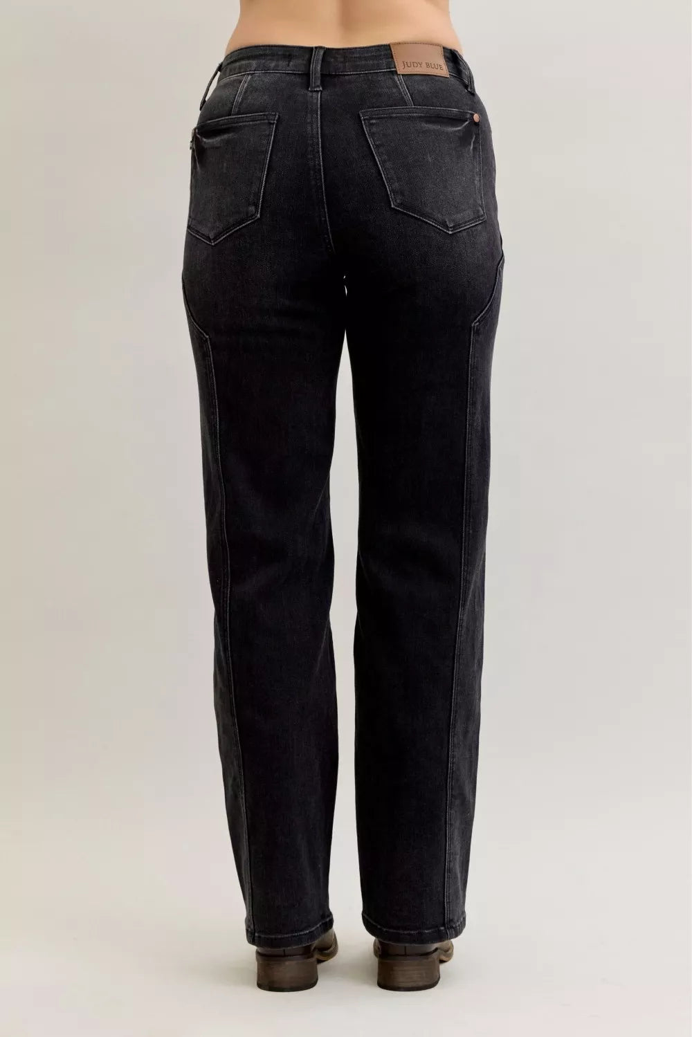 Light blue Judy Blue mid-rise straight jeans with western seam details, denim fabric, and classic five-pocket design.