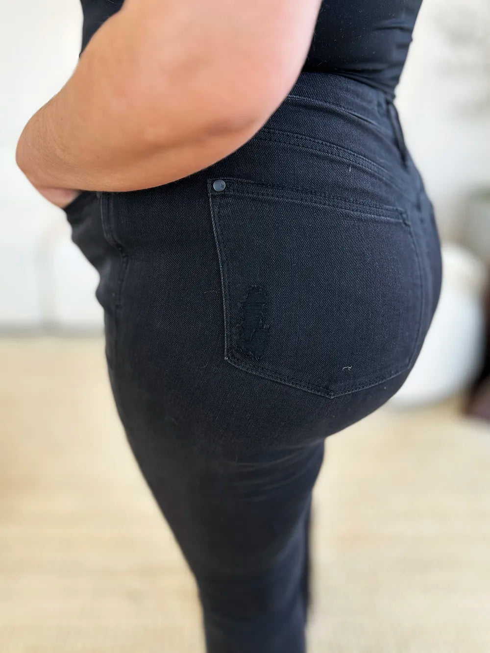 Black Judy Blue high waist distressed flare jeans for women, full size, with ripped details and a stylish fit.