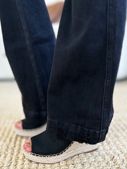 Black Judy Blue high waist distressed flare jeans displayed with front and back views, showcasing the stylish denim design.