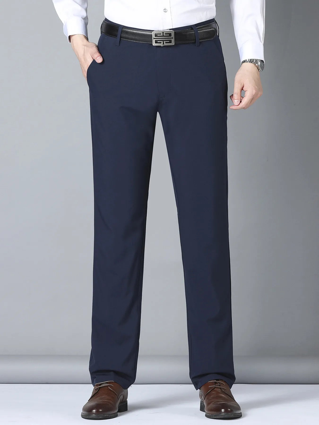 Black men's slim fit casual pants by Trendsi, featuring a tailored design and comfortable fit, shown on a model.