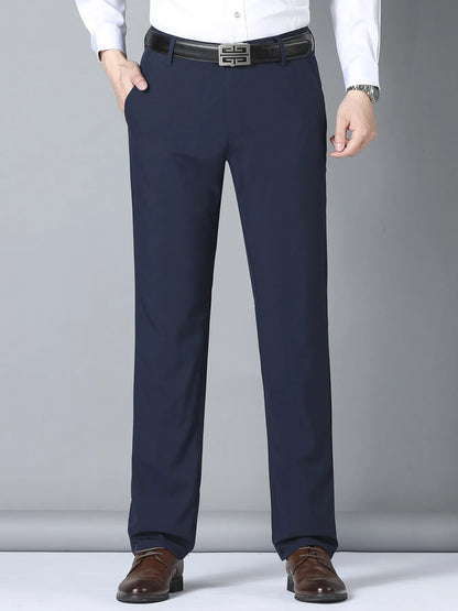 Black men's slim fit casual pants by Trendsi, featuring a tailored design and comfortable fit, shown on a model.