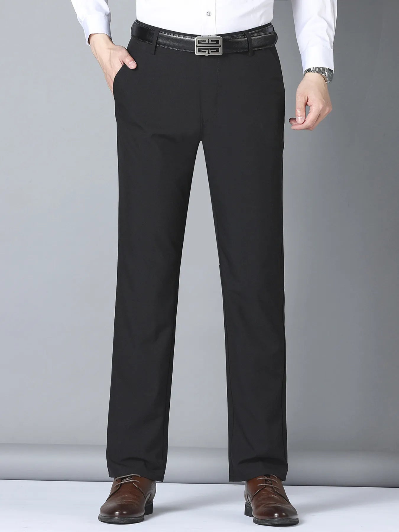Men's black slim fit casual pants by Trendsi, featuring a tailored design and comfortable fit, shown on a model.