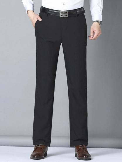 Men's black slim fit casual pants by Trendsi, featuring a tailored design and comfortable fit, shown on a model.