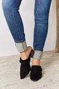 Black East Lion Corp pointed-toe braided trim mules with sleek design, featuring a stylish braided detail on the upper.