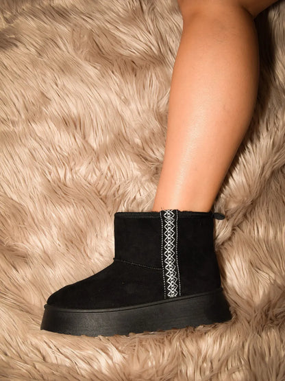 Black Wild Diva round toe platform boots with chunky heels and lace-up design, styled for a bold fashion statement.
