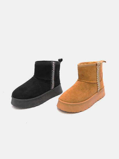 Black Wild Diva round toe platform boots with chunky heels and lace-up design, stylish footwear by Trendsi.
